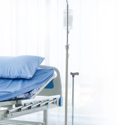 Clean adjustable patient's bed in hospital room. Clean adjustabl
