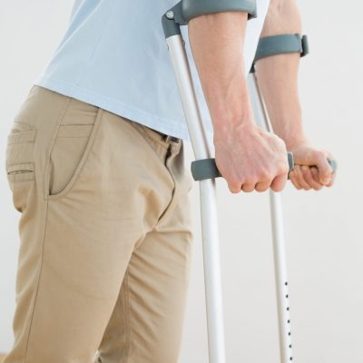 side-view-mid-section-man-with-crutches